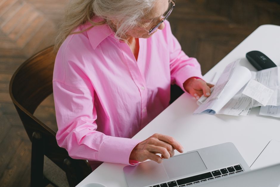 Person reviewing matrimonial site on laptop