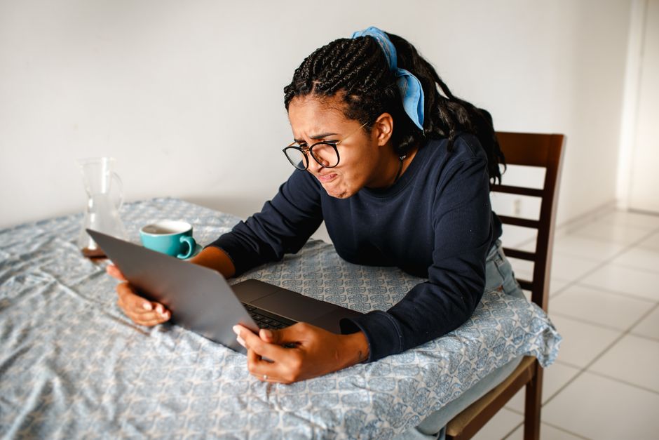 Woman looking at phone thoughtfully