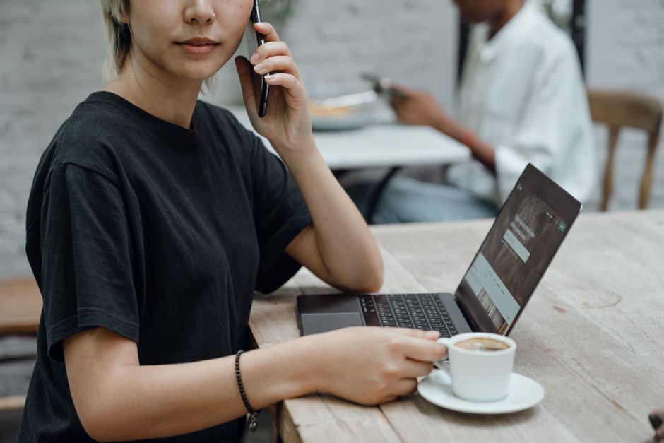 Woman evaluating profiles on laptop