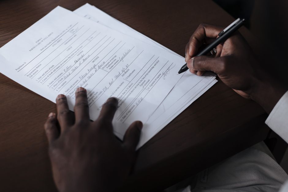 Person filling out a form